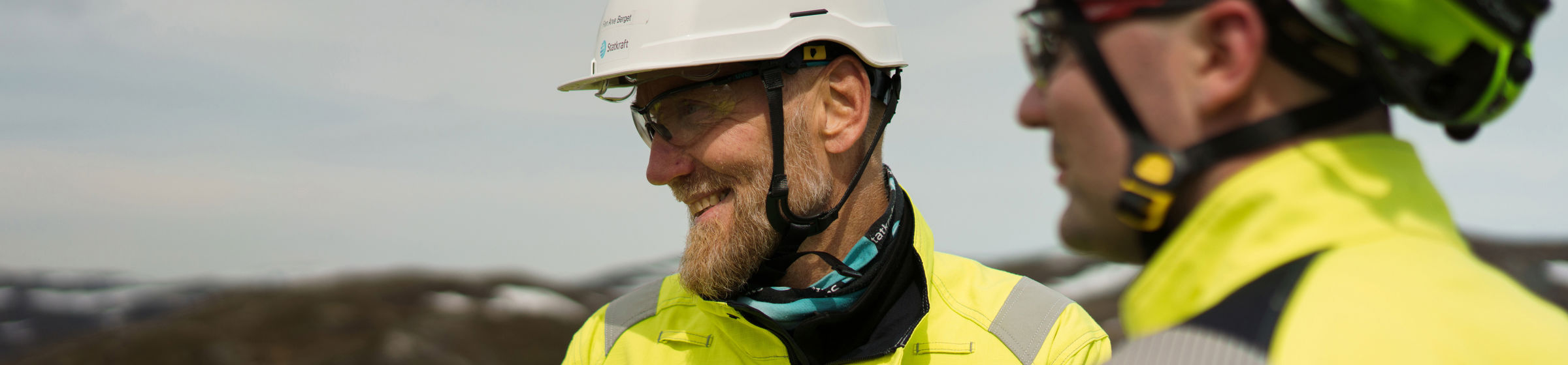 Three students smiling